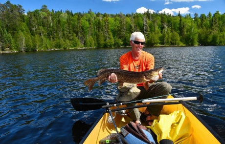 man fishing on a lake